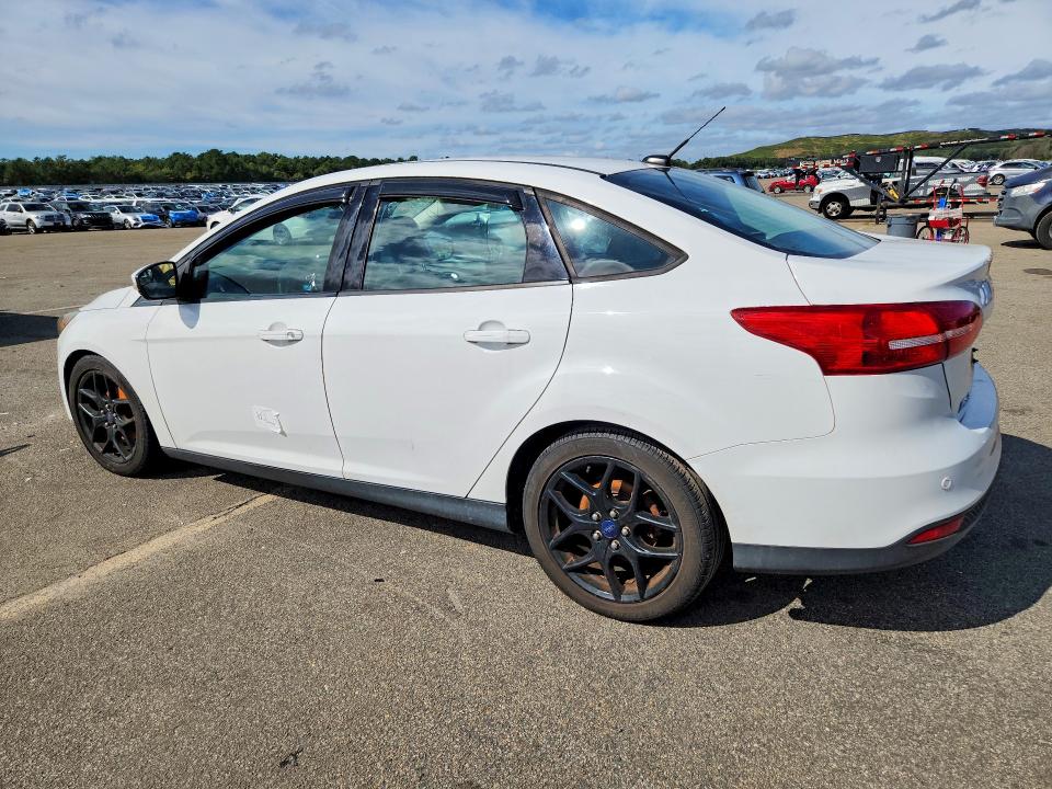 Снимка 2 от търг – 2016 FORD FOCUS с VIN 1FADP3F21GL223654