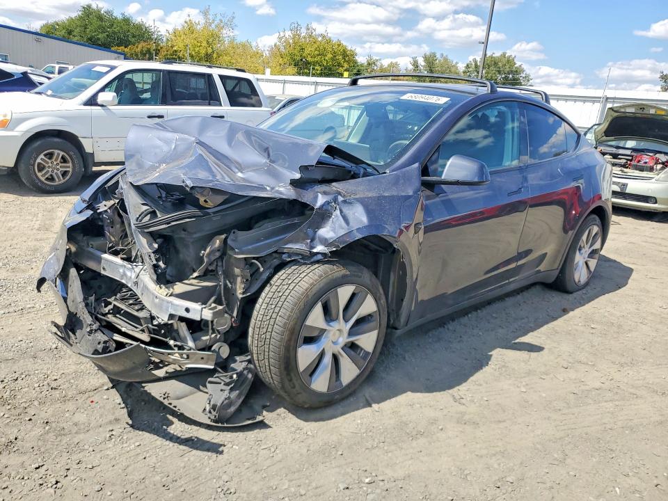TESLA MODEL Y 2023 with VIN 7SAYGAEE2PF865561 - Photo from auction