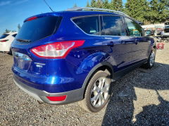 Photo 3 from auction – 2014 FORD ESCAPE with VIN 1FMCU9JX8EUD47668