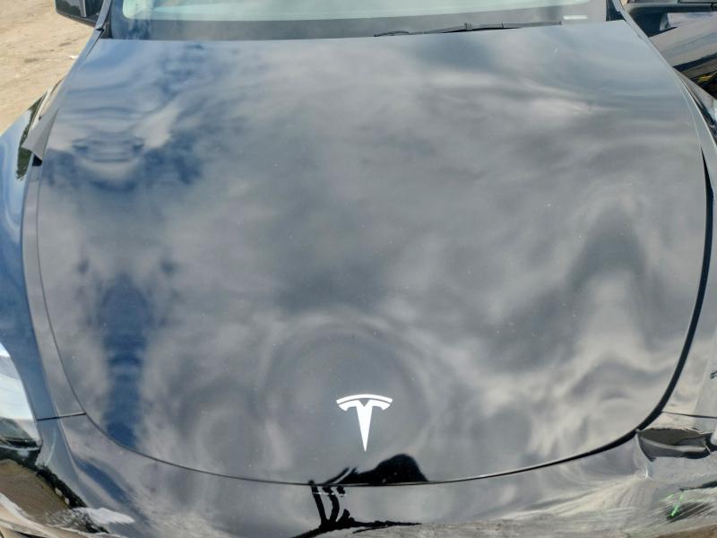 Photo 11 from auction – 2022 TESLA MODEL Y with VIN 7SAYGDEE0NA014287