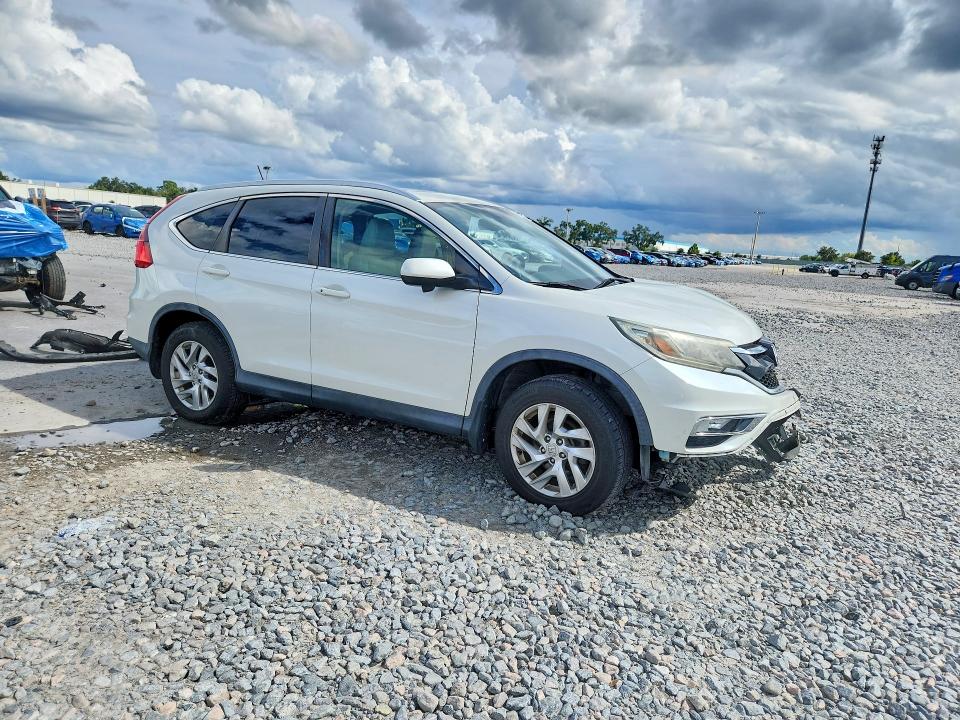 Photo 4 from auction – 2015 HONDA CR-V with VIN 5J6RM4H79FL030409