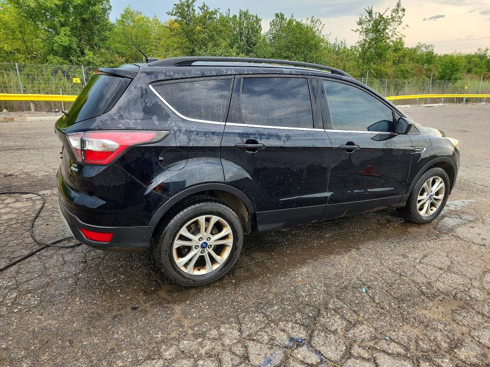 Photo 3 from auction – 2017 FORD ESCAPE with VIN 1FMCU9G9XHUA25899