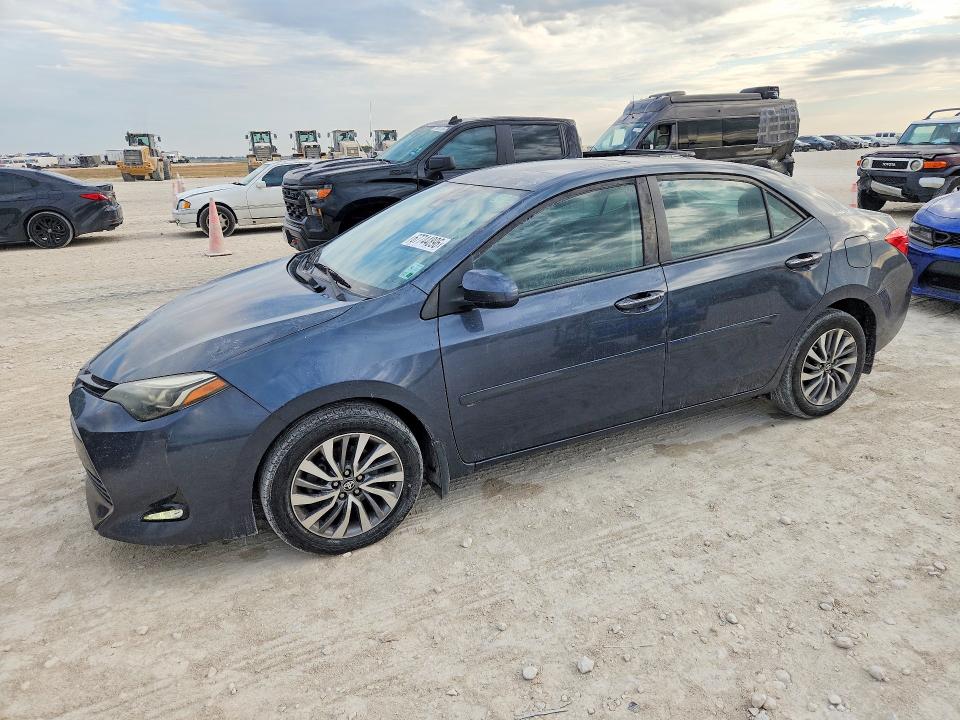 TOYOTA COROLLA 2018 with VIN 5YFBURHE6JP777386 - Photo from auction