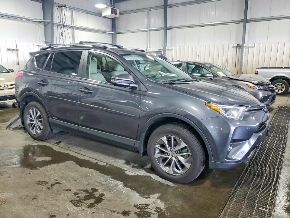 Снимка 4 от търг – 2017 TOYOTA RAV4 HYBRID с VIN JTMRJREV3HD122515