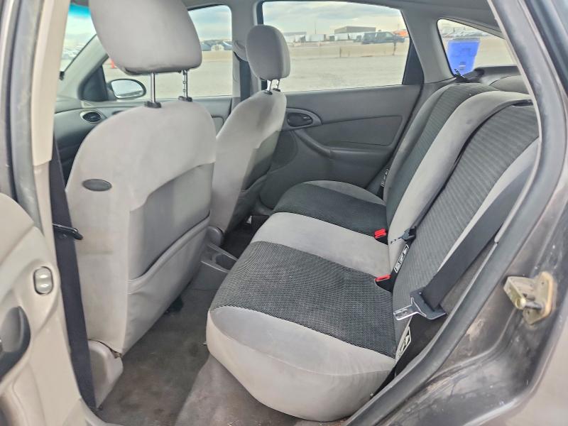 Фото 10 с аукциона – 2002 FORD FOCUS с VIN 3FAHP37382R219202