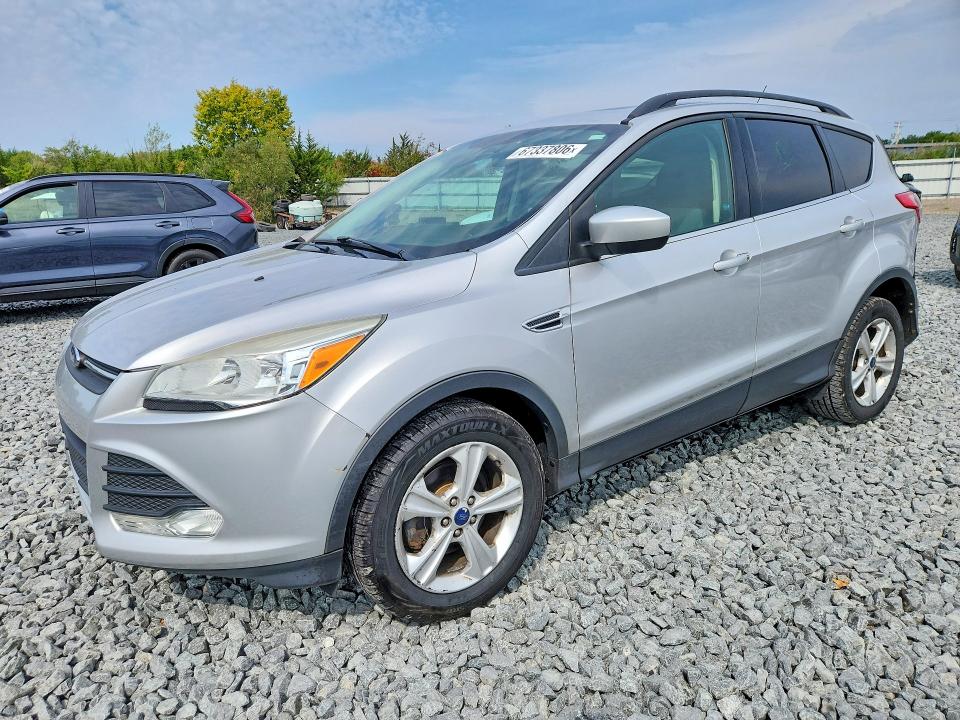 FORD ESCAPE 2015 with VIN 1FMCU0GXXFUB69993 - Photo from auction