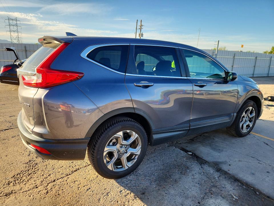Photo 3 from auction – 2018 HONDA CR-V with VIN 5J6RW2H81JL011613