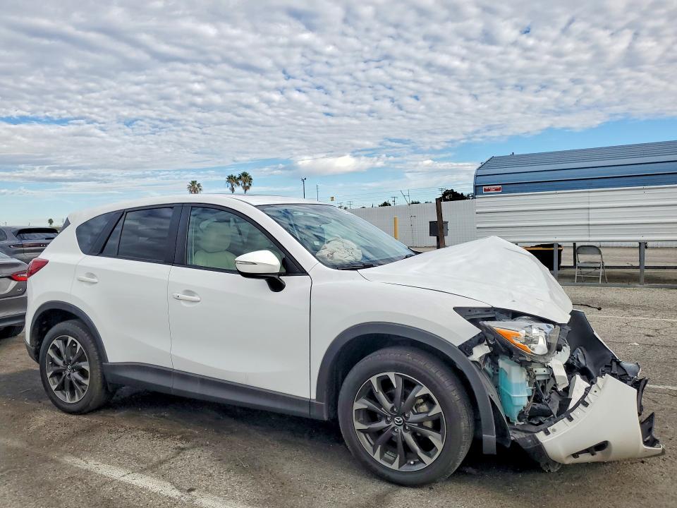 Photo 4 from auction – 2016 MAZDA CX-5 with VIN JM3KE2DY0G0876493