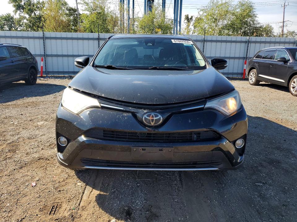 Photo 5 from auction – 2018 TOYOTA RAV4 with VIN 2T3RFREV7JW704997