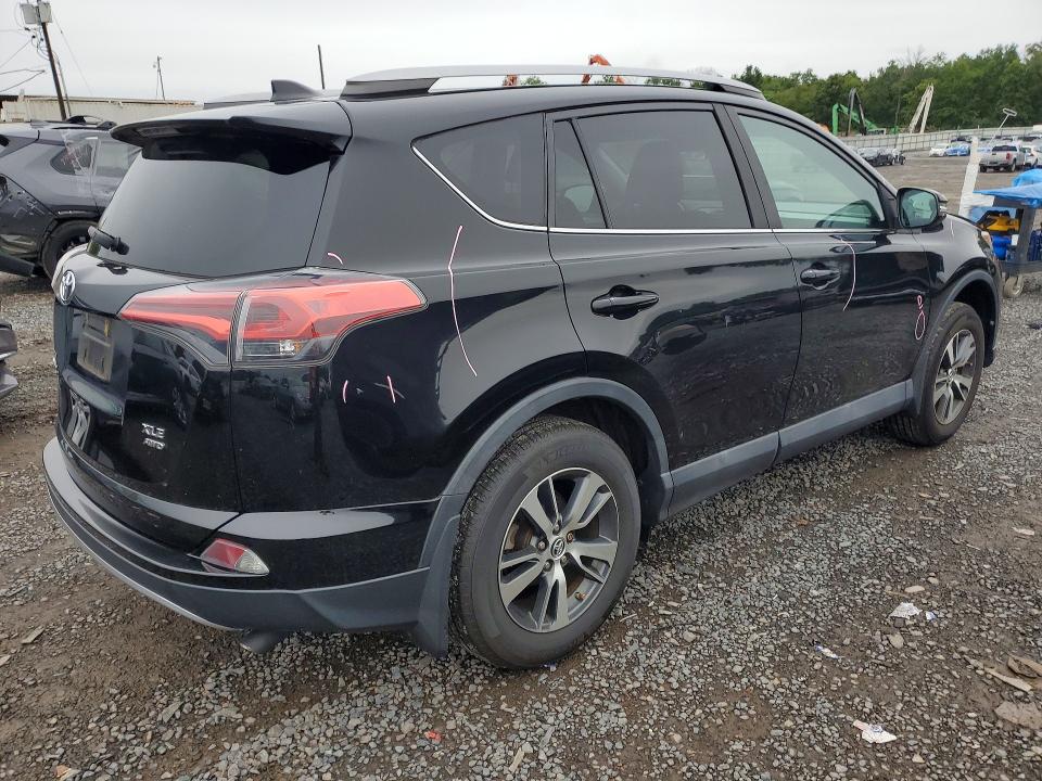 Photo 3 from auction – 2018 TOYOTA RAV4 with VIN 2T3RFREV5JW713651