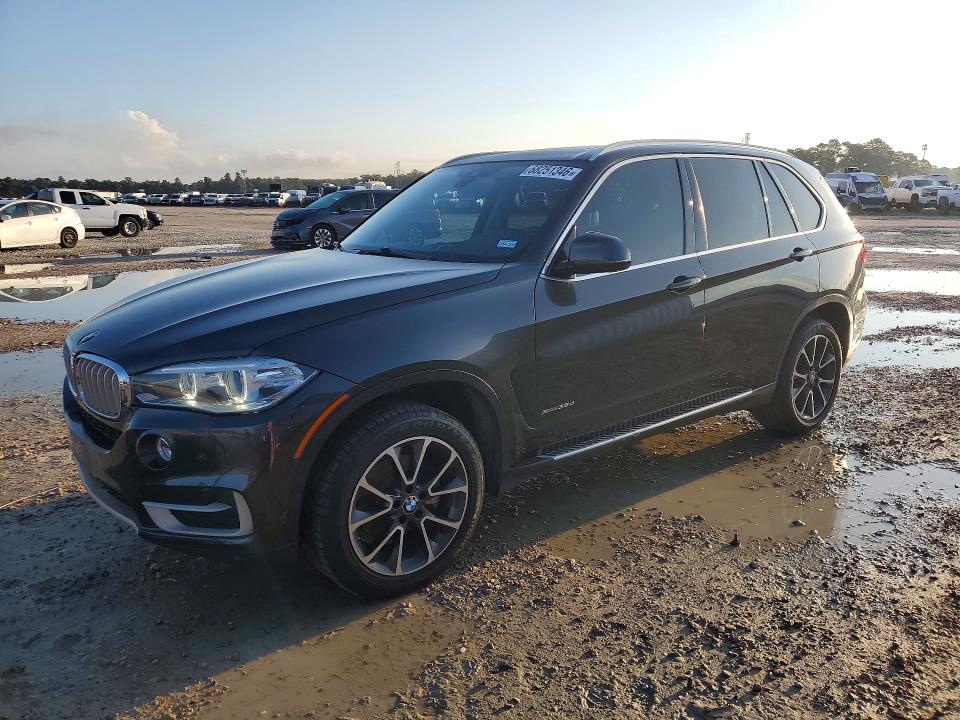 BMW X5 2014 with VIN 5UXKS4C56E0J97053 - Photo from auction