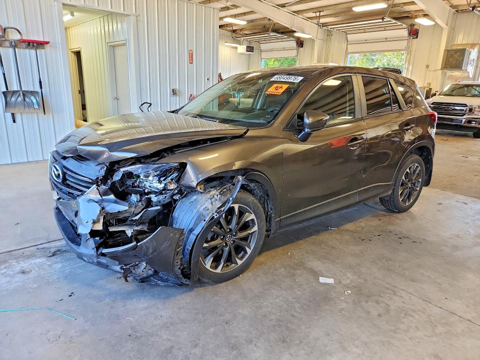 MAZDA CX-5 2016 с VIN JM3KE4DY4G0829172 - Фото с аукциона