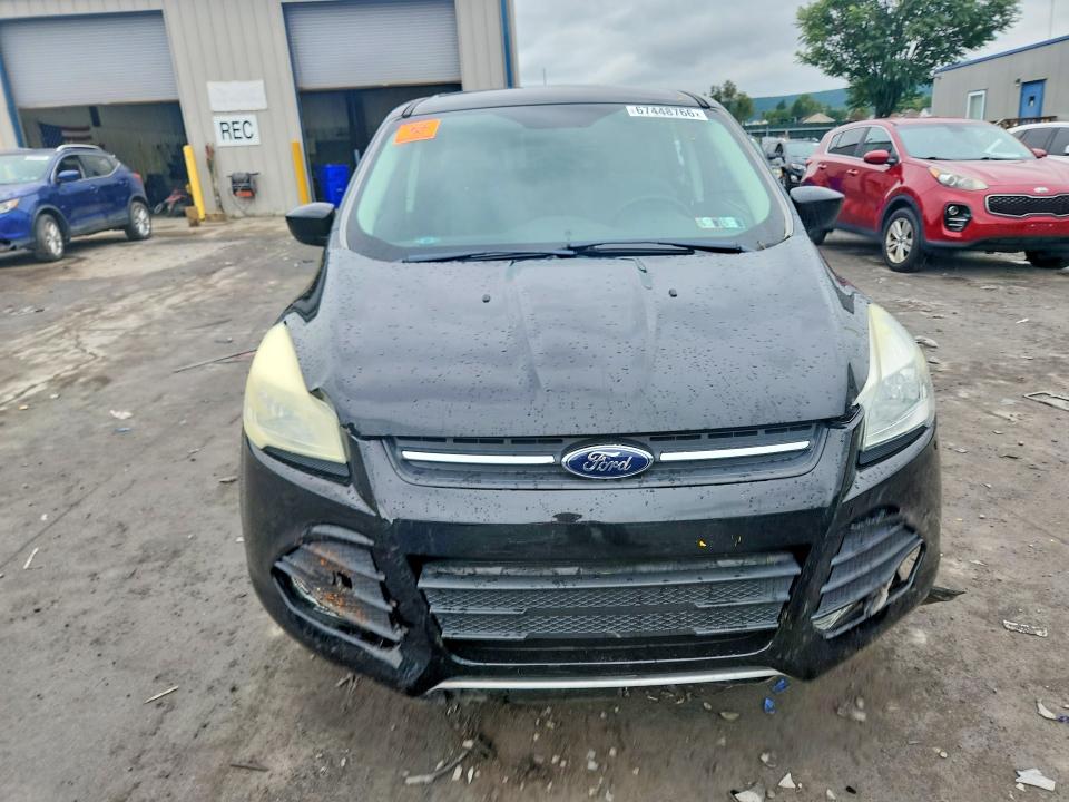 Photo 5 from auction – 2016 FORD ESCAPE with VIN 1FMCU9G9XGUB02981