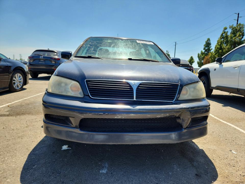 Photo 5 from auction – 2002 MITSUBISHI LANCER with VIN JA3AJ86E72U080765