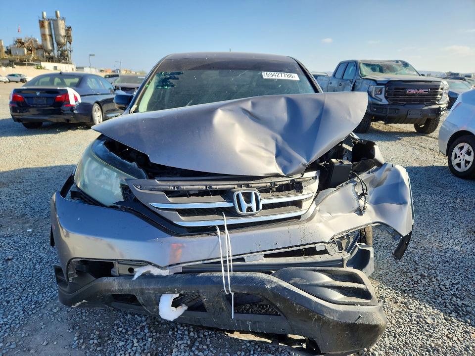 Photo 5 from auction – 2014 HONDA CR-V with VIN 2HKRM3H31EH523761