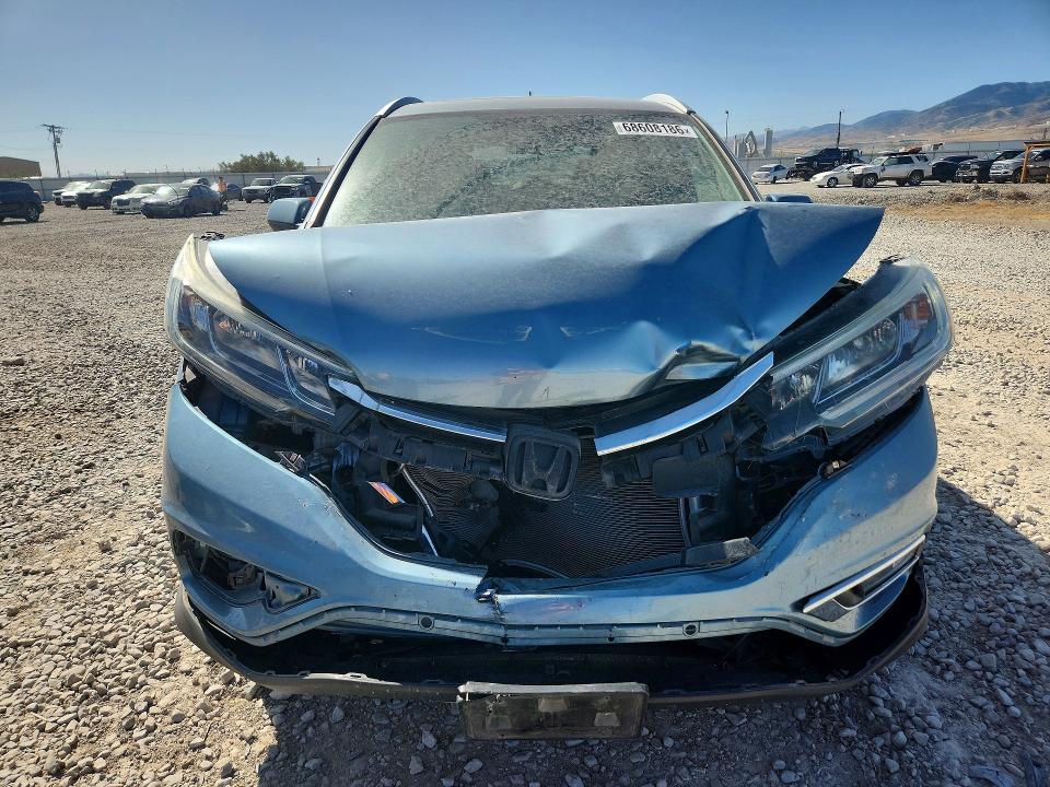Photo 5 from auction – 2016 HONDA CR-V with VIN 2HKRM4H79GH634411