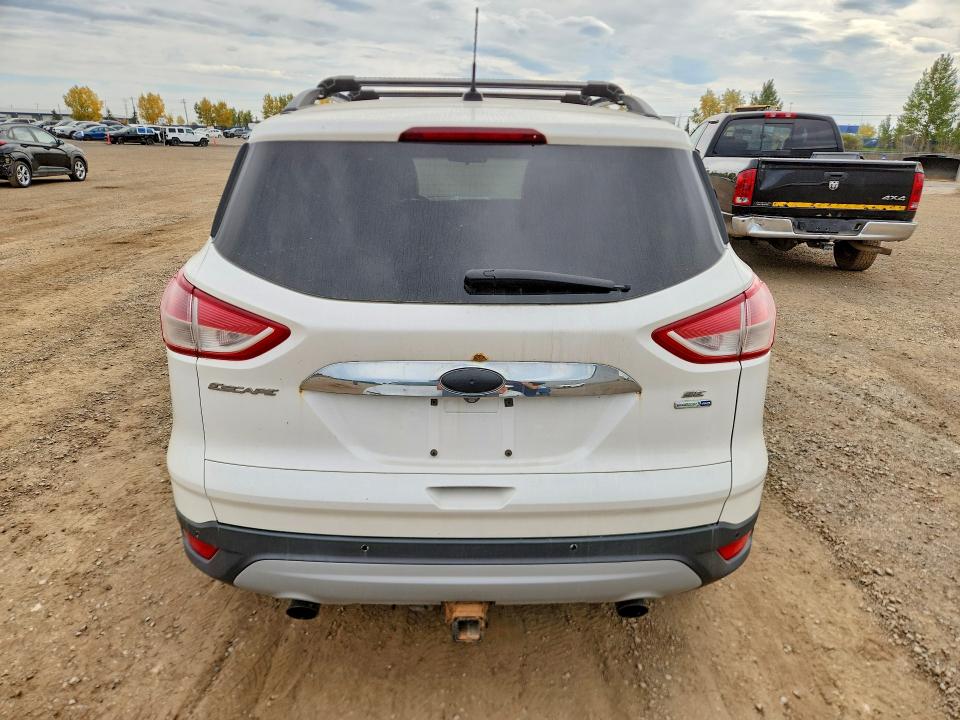 Снимка 6 от търг – 2014 FORD ESCAPE с VIN 1FMCU9G98EUD40129