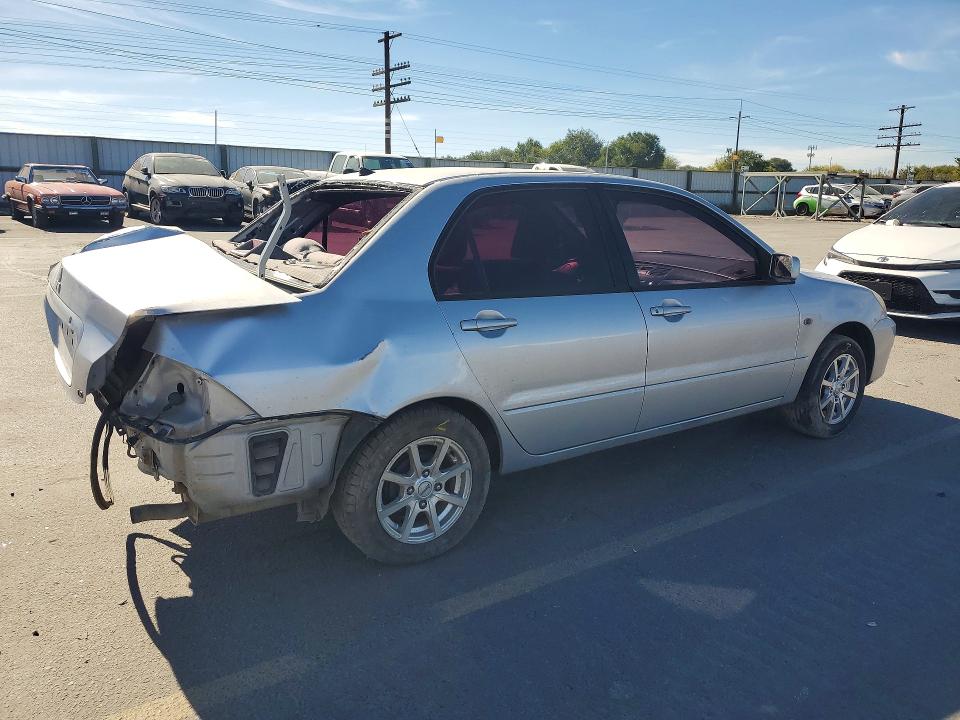 Снимка 3 от търг – 2004 MITSUBISHI LANCER с VIN JA3AJ36E64U043325