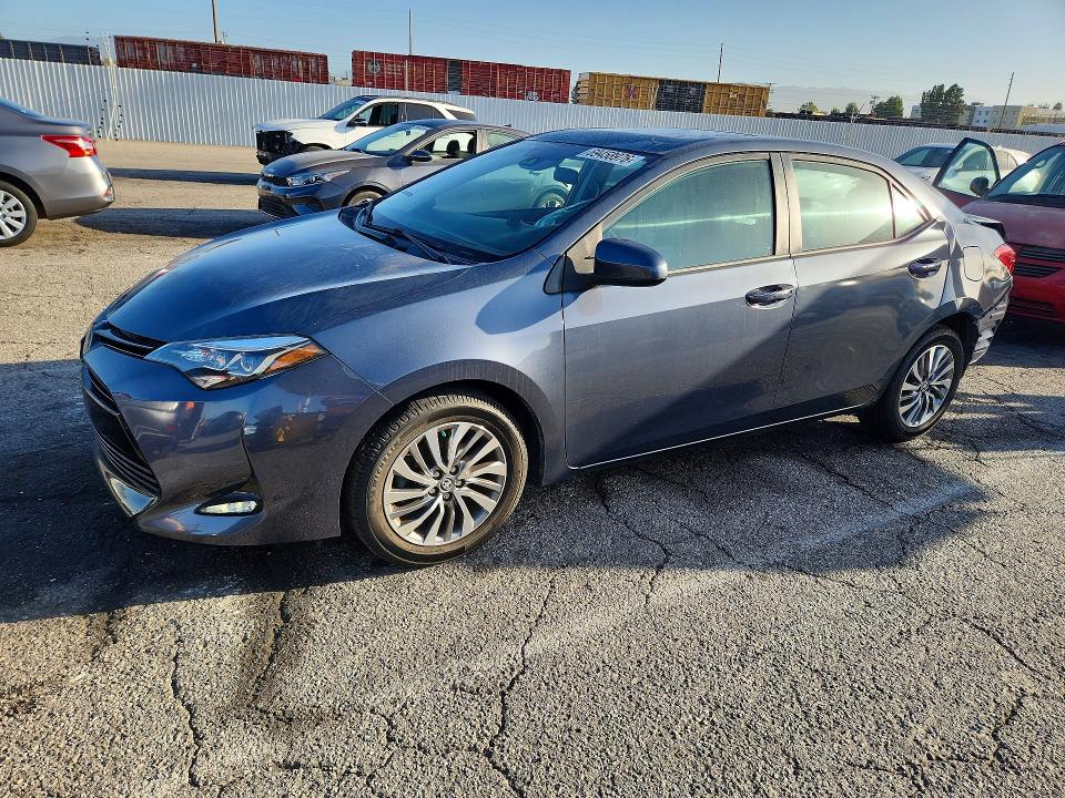 TOYOTA COROLLA 2018 with VIN 5YFBURHE3JP832070 - Photo from auction