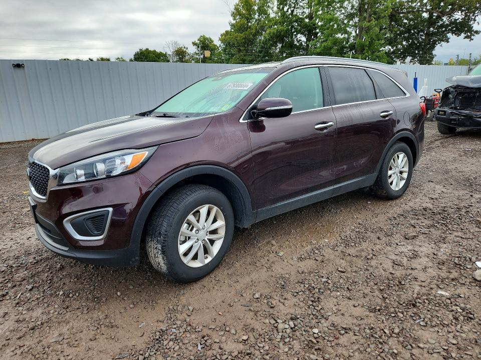 KIA SORENTO 2016 with VIN 5XYPG4A34GG027751 - Photo from auction