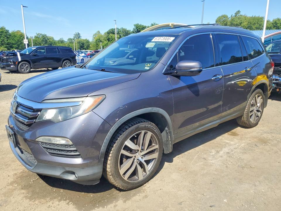 HONDA PILOT 2016 with VIN 5FNYF6H97GB024086 - Photo from auction