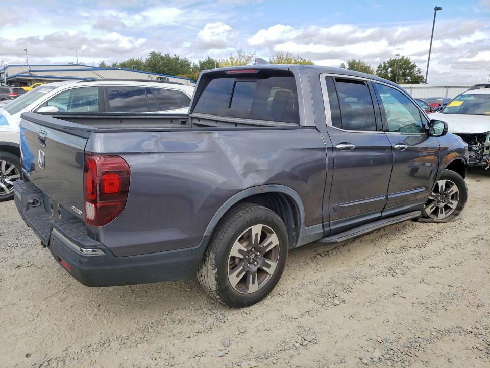 Photo 3 from auction – 2018 HONDA RIDGELINE with VIN 5FPYK3F77JB012398