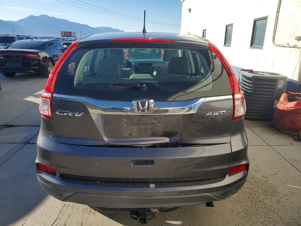 Photo 6 from auction – 2015 HONDA CR-V with VIN 2HKRM4H30FH696355
