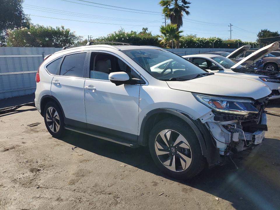 Photo 4 from auction – 2016 HONDA CR-V with VIN 5J6RM3H94GL013479