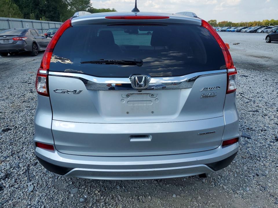 Photo 6 from auction – 2016 HONDA CR-V with VIN 5J6RM4H92GL015463