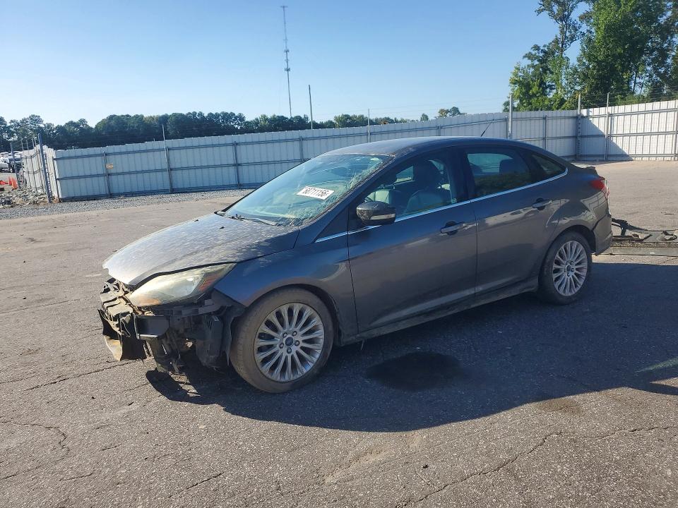 FORD FOCUS 2012 with VIN 1FAHP3J21CL365473 - Photo from auction