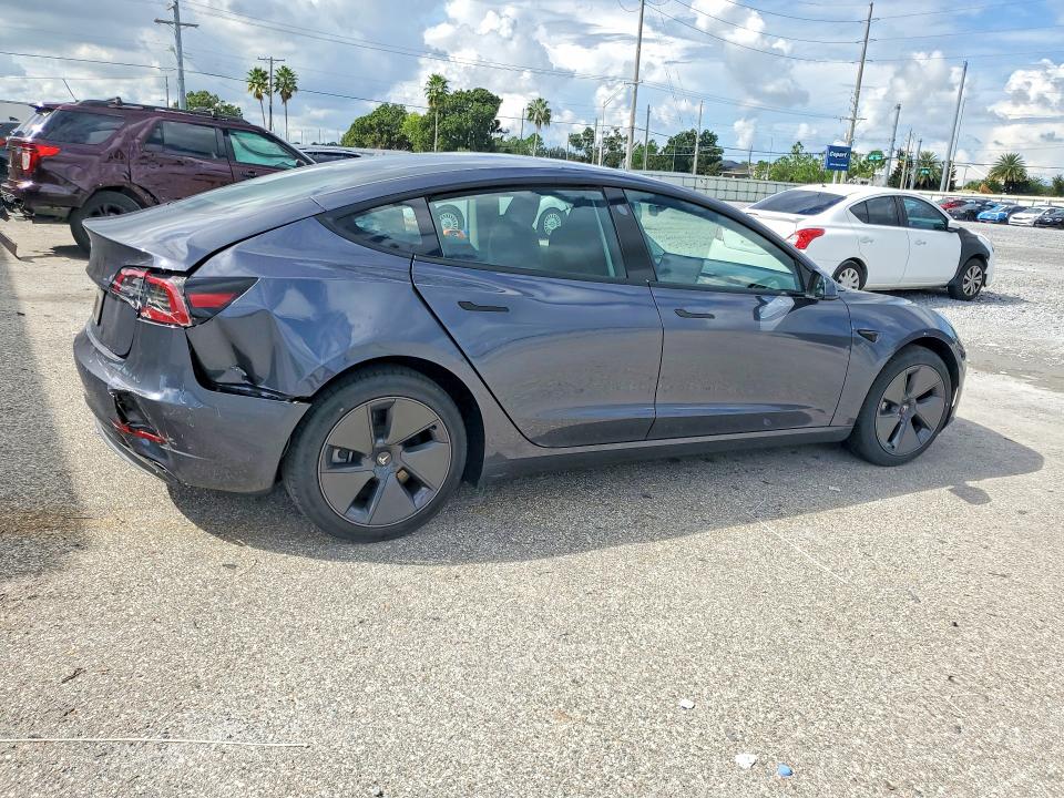 Снимка 3 от търг – 2023 TESLA MODEL 3 с VIN 5YJ3E1EA5PF698297