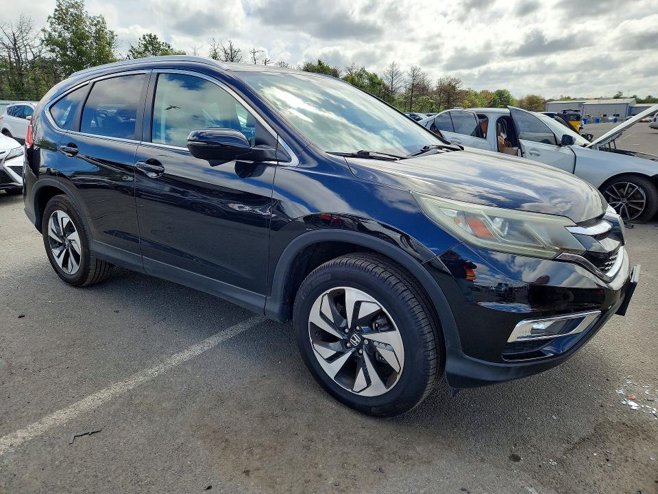 Photo 4 from auction – 2016 HONDA CR-V with VIN 5J6RM4H95GL098080