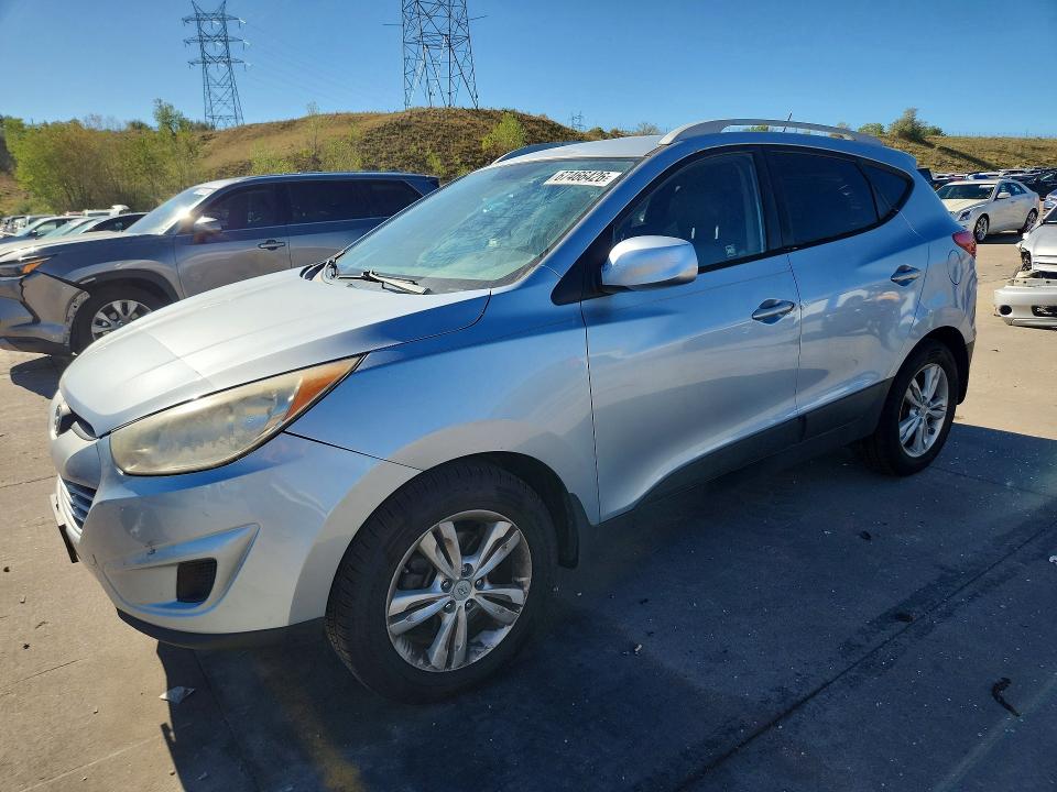 HYUNDAI TUCSON 2011 with VIN KM8JUCAC5BU159753 - Photo from auction