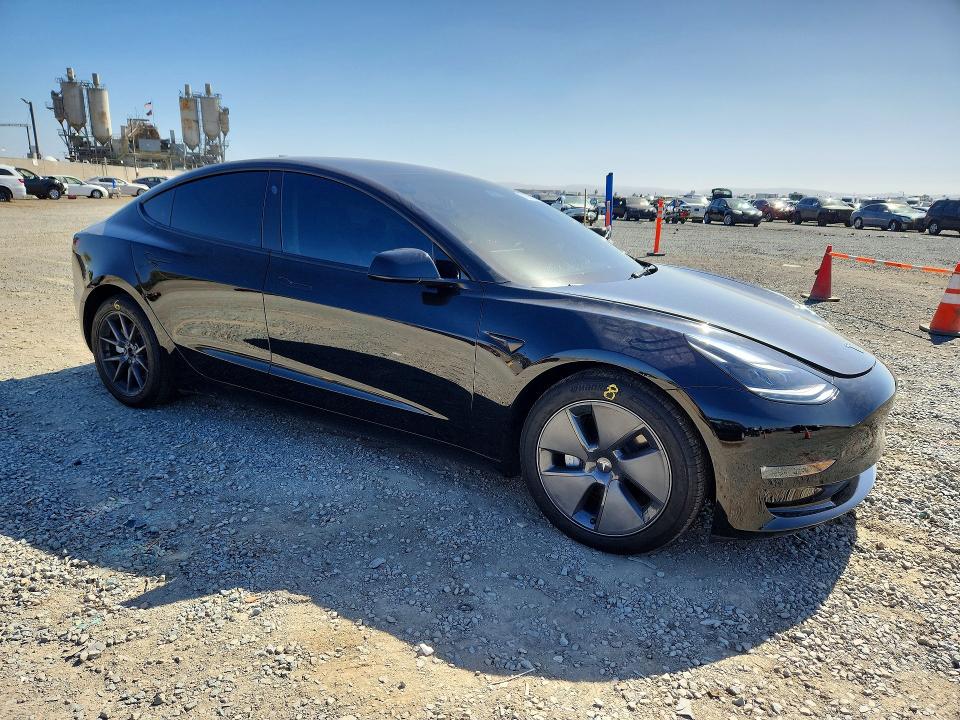 Снимка 4 от търг – 2023 TESLA MODEL 3 с VIN 5YJ3E1EB2PF694944