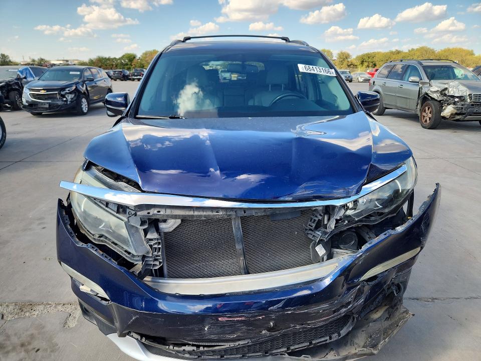 Photo 5 from auction – 2016 HONDA PILOT with VIN 5FNYF5H7XGB050299
