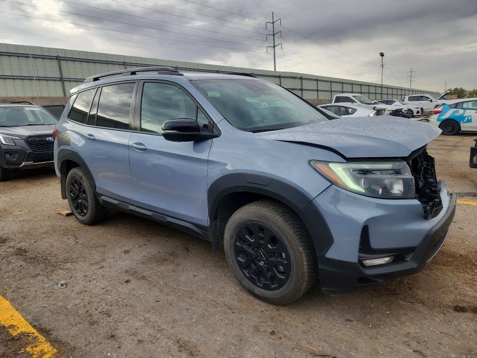 Photo 4 from auction – 2022 HONDA PASSPORT with VIN 5FNYF8H65NB027938