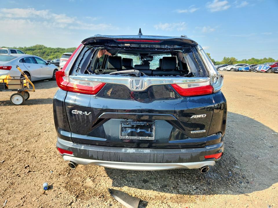 Photo 6 from auction – 2018 HONDA CR-V with VIN 7FARW2H99JE032683