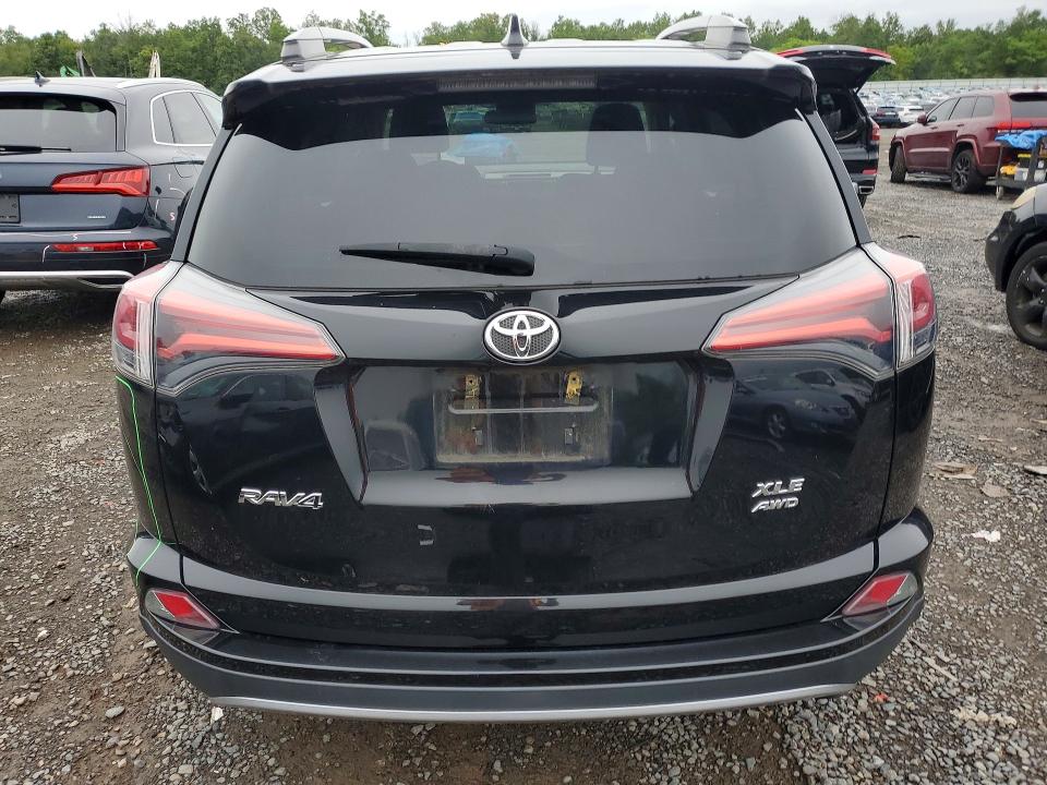 Photo 6 from auction – 2018 TOYOTA RAV4 with VIN 2T3RFREV5JW713651
