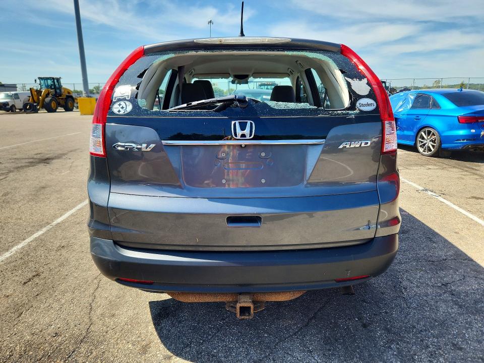 Photo 6 from auction – 2014 HONDA CR-V with VIN 2HKRM4H31EH670815
