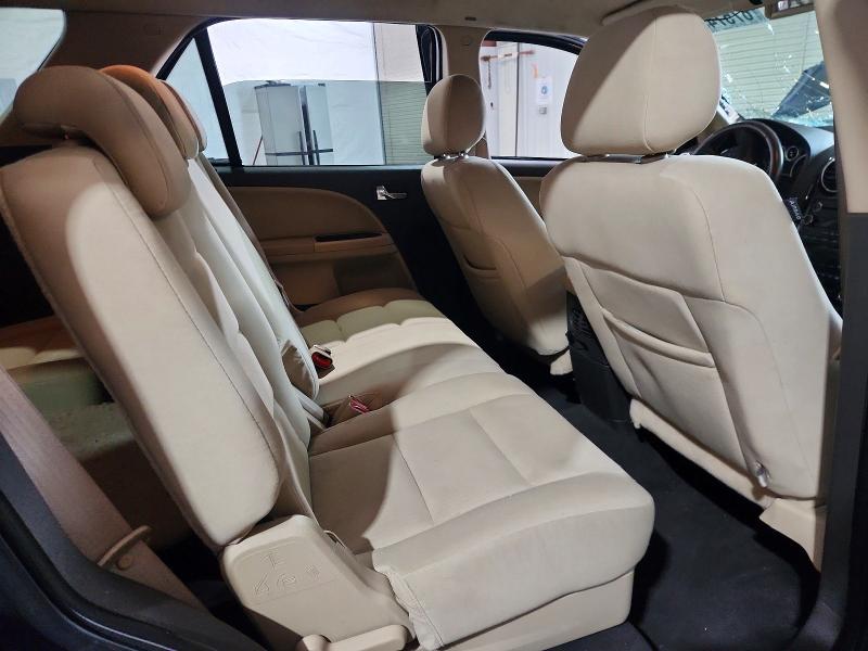 Снимка 11 от търг – 2009 FORD TAURUS X с VIN 1FMDK02W79GA03460