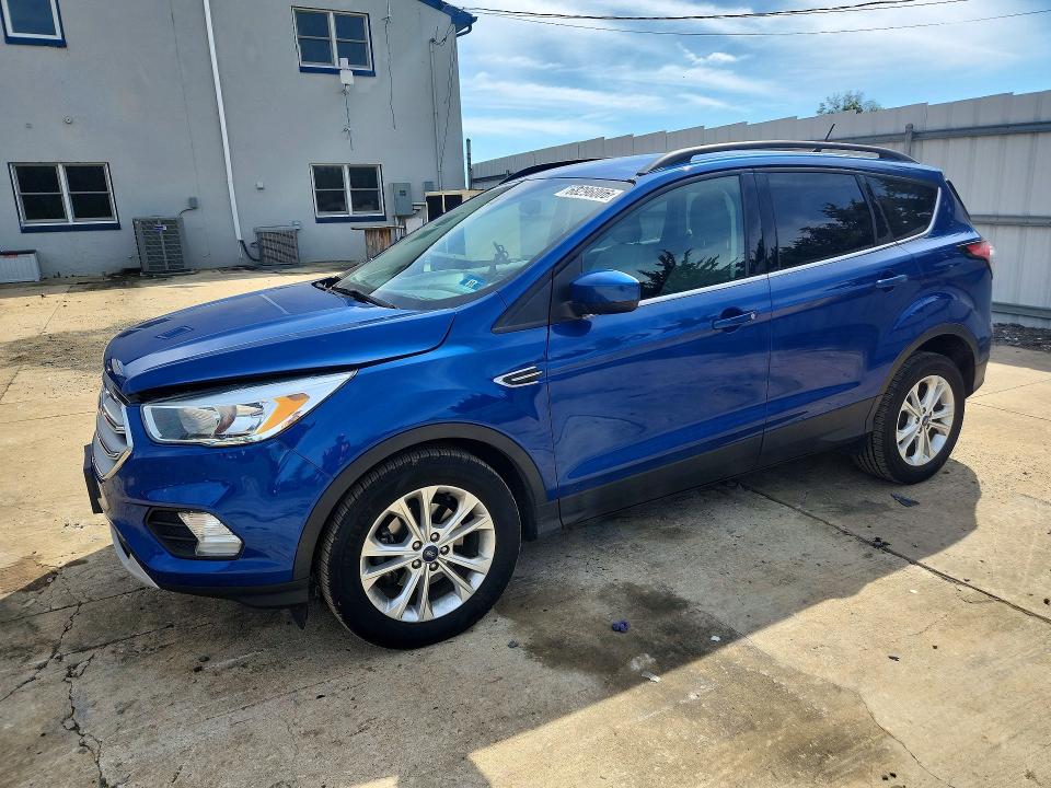 FORD ESCAPE 2018 with VIN 1FMCU0GD5JUA79875 - Photo from auction