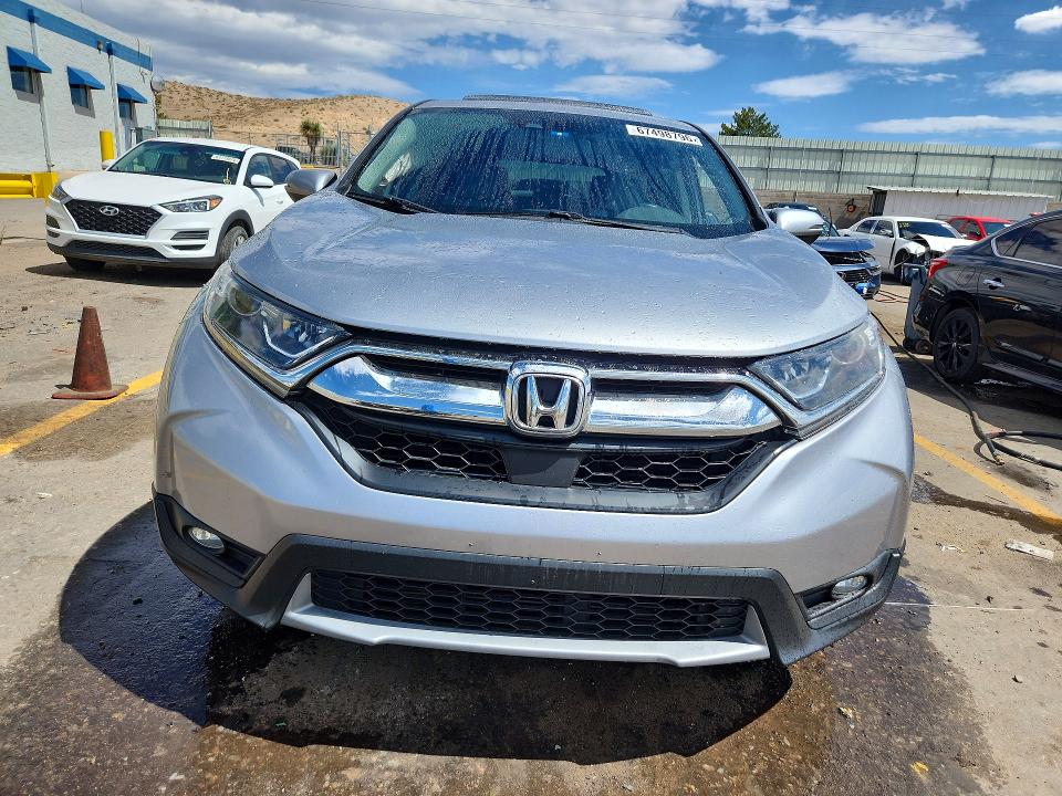 Photo 5 from auction – 2017 HONDA CR-V with VIN 7FARW1H83HE018581