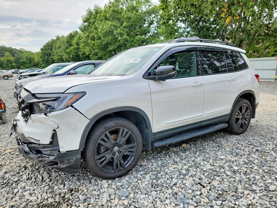 HONDA PASSPORT 2023 with VIN 5FNYF8H05PB013553 - Photo from auction