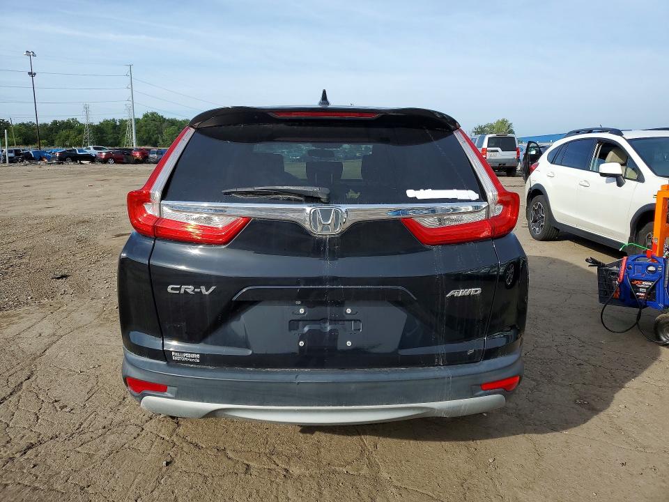 Photo 6 from auction – 2018 HONDA CR-V with VIN 2HKRW2H59JH628497