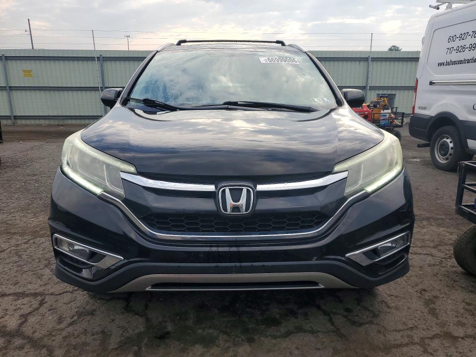 Photo 5 from auction – 2016 HONDA CR-V with VIN 2HKRM4H79GH663262
