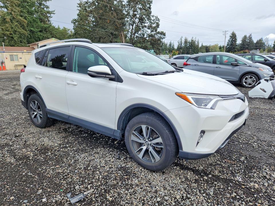 Photo 4 from auction – 2018 TOYOTA RAV4 with VIN 2T3RFREV3JW801050
