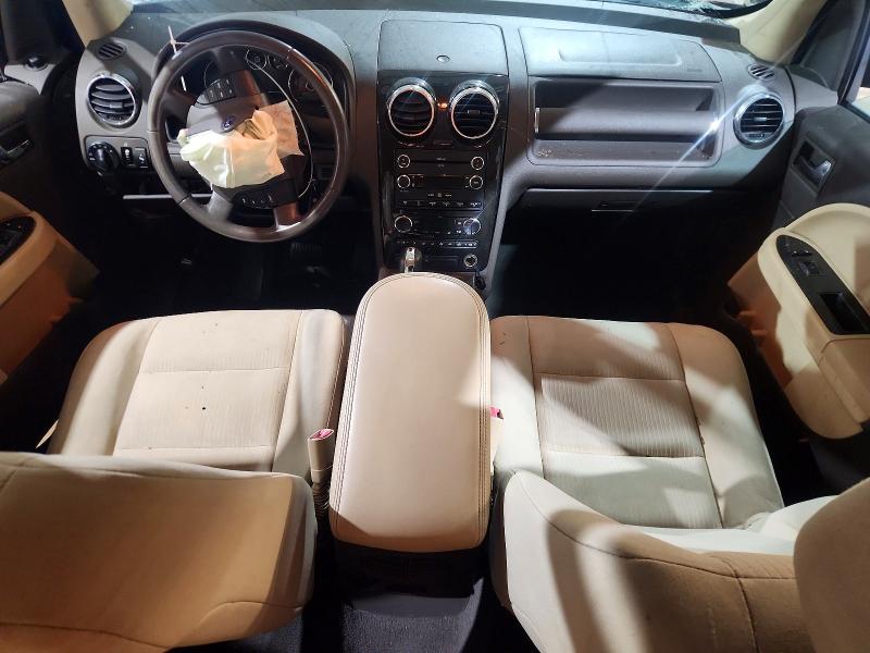 Снимка 8 от търг – 2009 FORD TAURUS X с VIN 1FMDK02W79GA03460