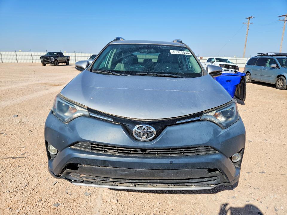 Photo 5 from auction – 2016 TOYOTA RAV4 with VIN 2T3WFREV0GW268800