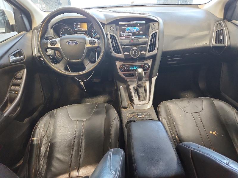Photo 8 from auction – 2014 FORD FOCUS with VIN 1FADP3N21EL395620