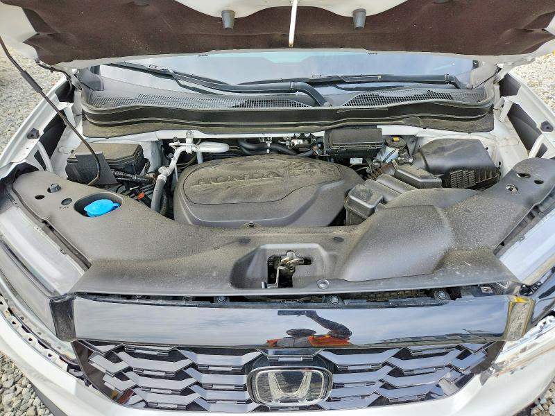Photo 12 from auction – 2023 HONDA PASSPORT with VIN 5FNYF8H05PB013553